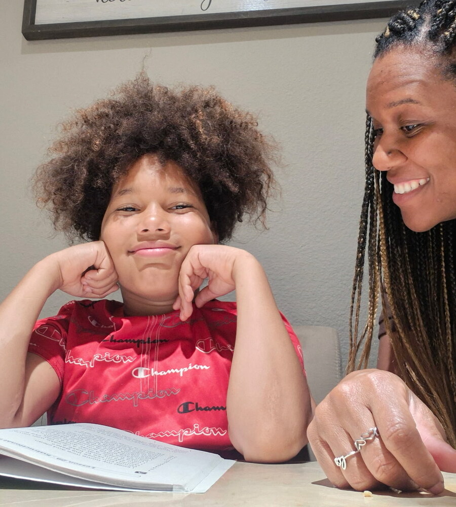 A Noggin student and mentor reading together